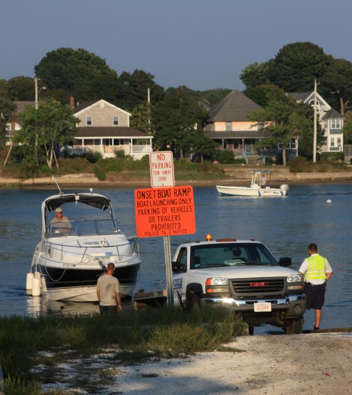 The Harbormaster Department assisted boaters in removing their vessels from the water at the Onset Boat Ramp on Thursday afternoon. BY JAIME REBHAN