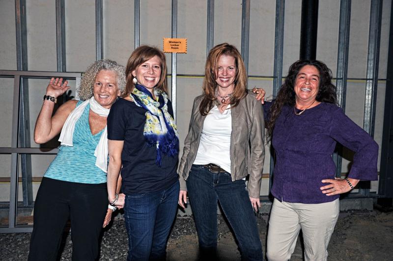 Pictured, left to right, are Marsha Hartley, Nicole Merusi, Andrea Nordberg and Pam Hastings, who are four of the models in the Gleason Family YMCA Fashion Show & Tribute to Women at Salerno’s in Onset. They are standing in the shell of the future women’s locker room at the Gleason Family YMCA. COURTESY JILL TOMPKINS