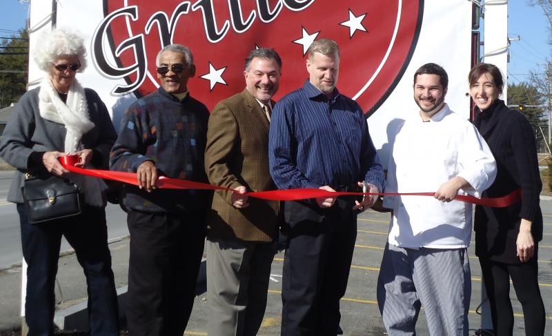 Town representatives and restaurant management gather on February 9 to celebrate the official opening of Grille 28. From right to left, Kolina Kirkham, Chef Jarrod Ross, Owner Brian Welch, Town Administrator Mark Andrews, Chair of the Board of Selectmen Walter Cruz, and Jody Larson, mother of Kolina Kirkham. COURTESY KOLINA KIRKHAM