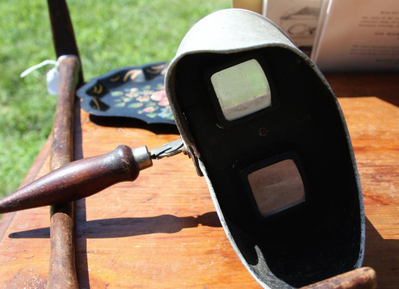 This is known as a "stereoscope." It was used to view two very similar, but not identical, cards. When looking through the viewfinder, the eyes saw one, three-dimensional image. BY JAIME REBHAN