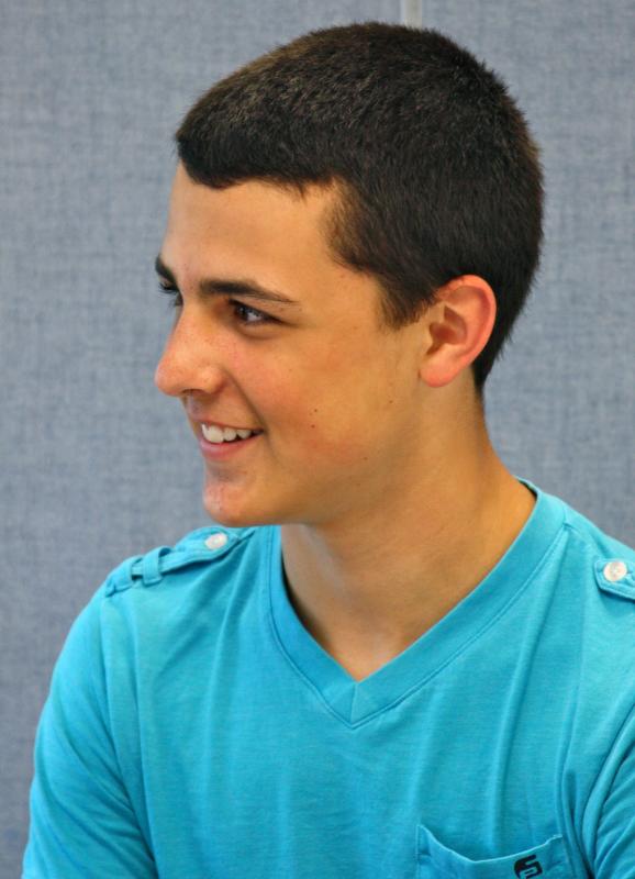 Sophomore football player Joe Nash says coaches have "pushed us hard" during the summer practices, "but it's just going to make us better in the end." He says he's "excited to see some Friday night game time." BY JAIME REBHAN