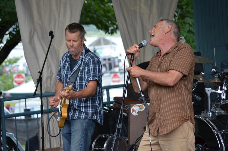 Guitarist Buck Shank and lead singer Johnny Hoy of Johnny Hoy and the Bluefish get into it at the Blues Fest. BY AUSTIN ADAMS