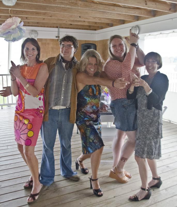 From left to right: Kathy Anderson, Ethan Anderson, Melissa Dyer, Jessica Hibbert and Susan Olson do "Charlie's Angels" poses at Disco Night. BY GEORGIA SPARLING