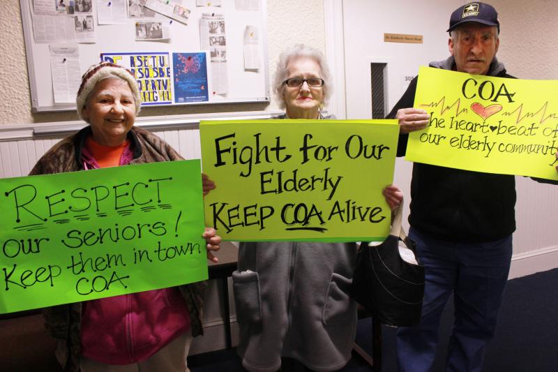 Joann Bruno (left), Barbara Russell (center), and Rudy Gentile (right) are members of the Supportive Day Program, which "provides a safe, structured environment for seniors who are isolated, experience memory or personal loss, are recovering from personal illness or injury, or have certain physical restrictions because of age related disabilities" (The Senior Beacon, April 2016). They represented the program during Tuesday night's Board of Selectmen's meeting, and are fighting to keep the program running. BY ZARRIN TASNIM AHMED