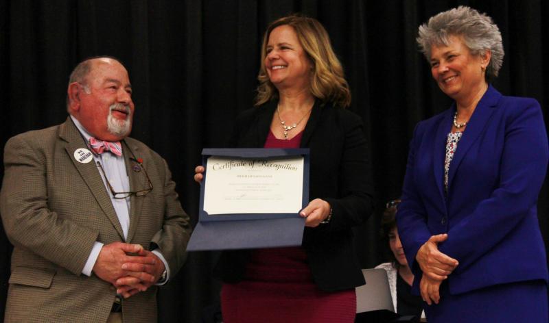 School Committee Chair Melvin Lazarus (left) and Superintendent of Schools Dr. Kimberly Shaver-Hood (right) presents Heidi Di Giovanni with a certificate of recognition. Di Giovanni has been a teacher at Minot Forest Elementary School for 30 years, and is known as an "awesome baker" and for her "fudgey Fridays," according to Principal Joan Seamans. BY ZARRIN TASNIM AHMED