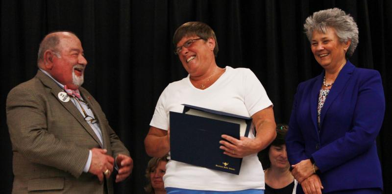 "I'll take care of you," is what Susan Atkins, a nurse at Wareham Middle School, has told her patients time and time again. She is seen here (center) receiving a certificate of recognition for 20 years of service at Wareham Middle School from School Committee Chair Melvin Lazarus (left) and Superintendent Dr. Kimberly Shaver-Hood (right). BY ZARRIN TASNIM AHMED