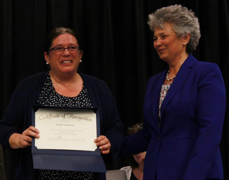 Superintendent Dr. Kimberly Shaver-Hood (right) present Marie Ferreira (center) with a Certificate of Recognition for her 20 years of service as a bus driver and paraprofessional at Wareham Middle School. "When the kids need it the most, you are there," said Principal Dan Minkle . BY ZARRIN TASNIM AHMED