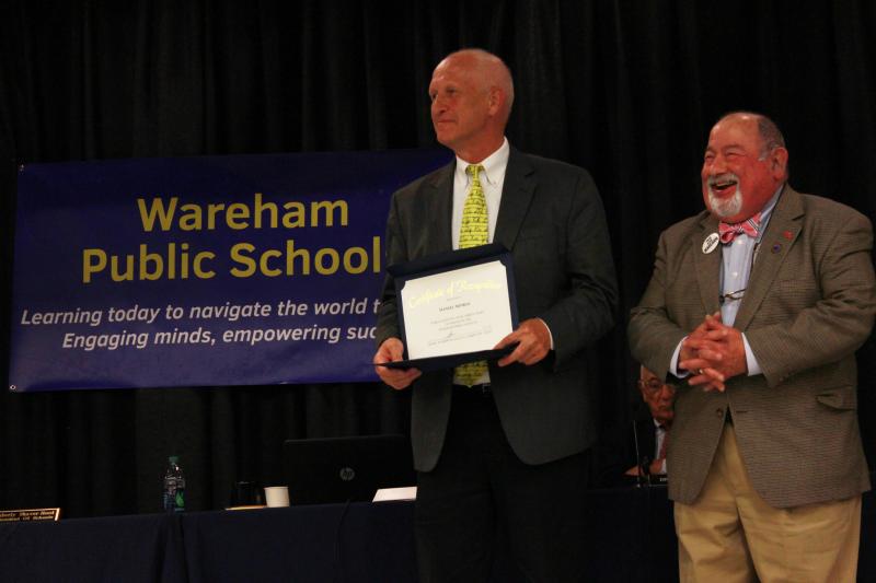 Wareham Middle School Principal Dan Minkle (center) was recognized for his 30 years of service in the school system. He will retire at the end of this school year. Next to him is School Committee Chair Melvin Lazarus. BY ZARRIN TASNIM AHMED