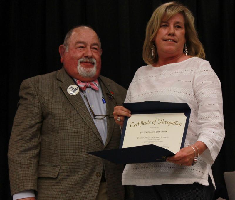 School Committee Chair Melvin Lazarus (left) hands a certificate of recognition to Jane Collins-Fondulus (right) for her 20 years of service as a coordinator for Wareham schools. BY ZARRIN TASNIM AHMED