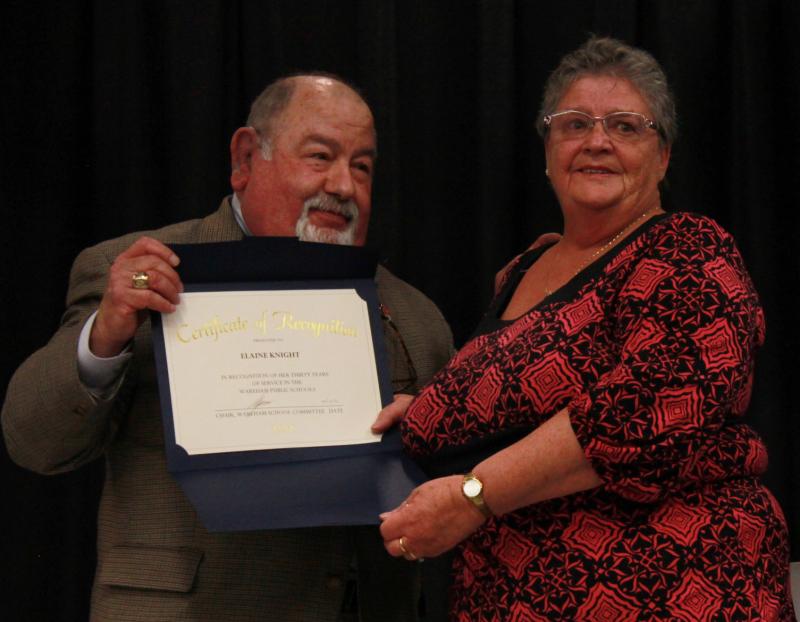 Nearly in tears, Elaine Knight (right) was recognized for her 30 years as a bus driver for Wareham. She's seen here receiving a certificate of recognition by School Committee Chair Melvin Lazarus (left). Finance Manager Michael MacMillan described her as a "teacher, custodian, and friend to some of our most vulnerable students." BY ZARRIN TASNIM AHMED