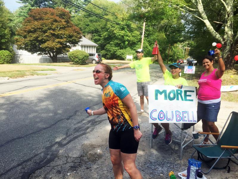 From left: Katie Moulding cheers on Pan-Mass Challenge riders along with her husband, Chris, daughter Natalia and family friend Mayte Santisteban. BY MATTHEW BERNAT
