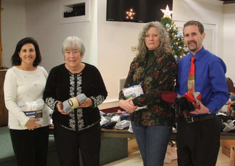 From left: Lucille Cassis of Father Bill's & MainSpring, Elks Acting Exalted Ruler Sue Gifford, Elks Treasurer Bonnie Cottult and Michael O'Neill Jr. of Turning Point stand with the donations. BY MATTHEW BERNAT