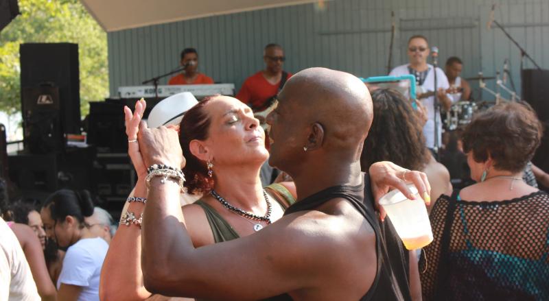 A couple dances at the Cape Verdean Festival held this summer. The event attracts thousands of people to downtown Onset where Cape Verdean food and music are the highlights. BY MATTHEW BERNAT
