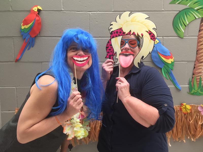 Maria Golemo, right, and another YMCA employee pose for a picture at a selfie station set up for the group’s member appreciation week in March. BY CAROLYN BICK