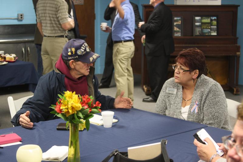 Ted Pemberton and Rose Berry chat on Thursday during an event designed to raise awareness for The Moving Wall. The scaled down Vietnam War Memorial replica is slated to come to Wareham this summer. BY MATTHEW BERNAT