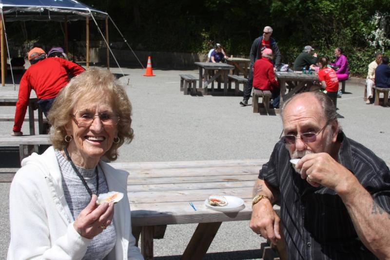 Margie Connolly (left) and Bob Connolly try oysters from Indian Cove Aquaculture in Wareham. BY LYDIA GOERNER