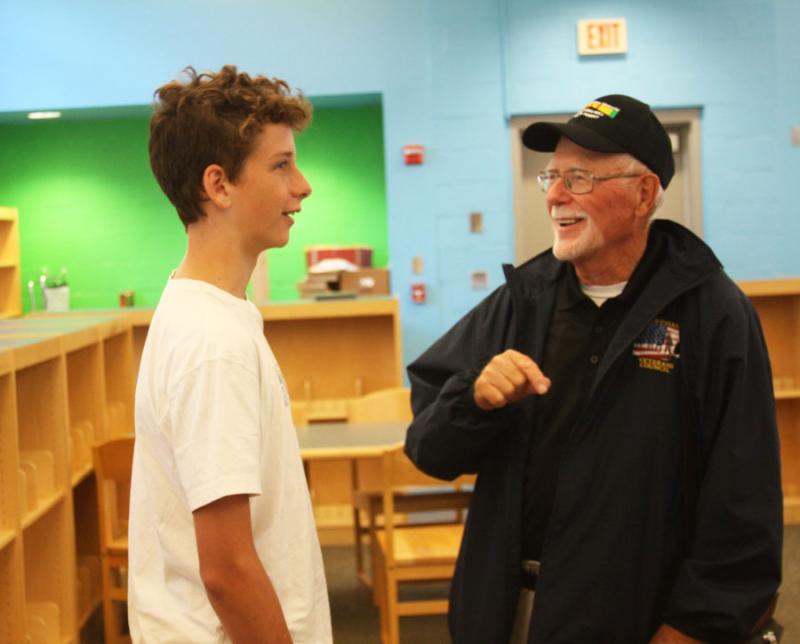 Zachary Yarnall of Bourne, left, talks to Chairman of the Wareham Veterans Council Bob White about the Vietnam Moving Wall. BY LYDIA GOERNER