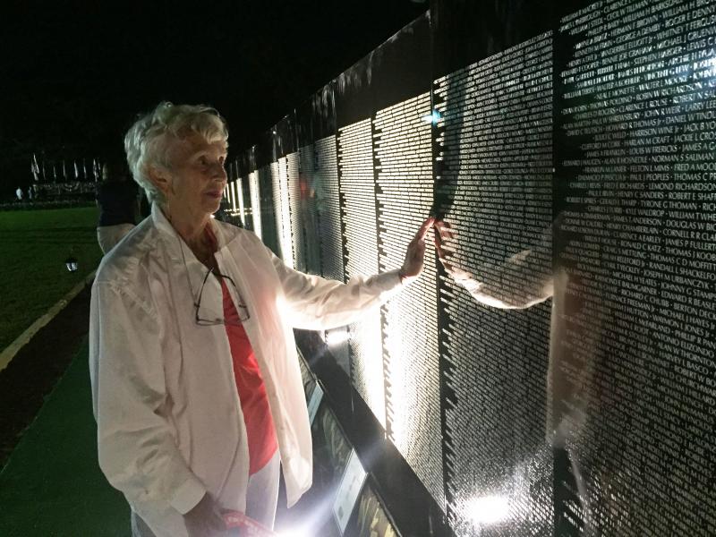 Lois Ladd visits the Moving Wall for her third time during its stay in Wareham. Ladd's son-in-law returned safely home from the Vietnam War, but she said she is "overcome with emotion" standing in front of the wall. BY LYDIA GOERNER