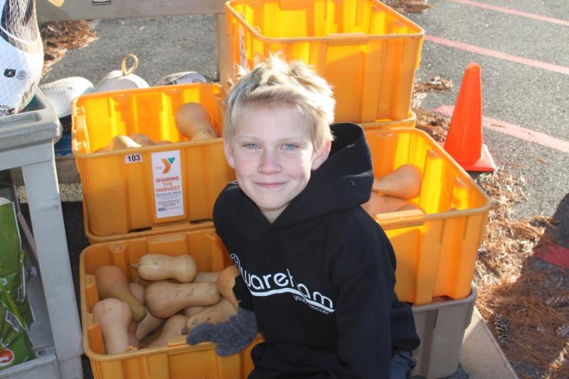 Jackson Veugen volunteered at the Gleason Family YMCA on Monday to help pass out food. BY LYDIA GOERNER