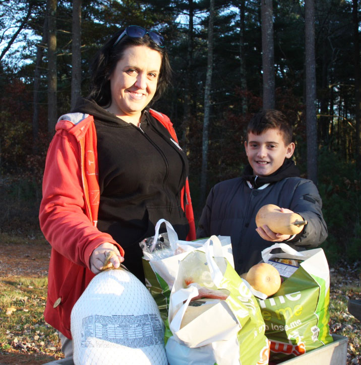 Jennifer Cuddy and David West, 11, from New Bedford, helped out at the YMCA during the afternoon. BY LYDIA GOERNER