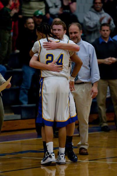 Jordan Rezendes gets a big hug from team co-captain Patrick Murphy after recording his 1000th point. BY ANDREW W. GRIFFITH