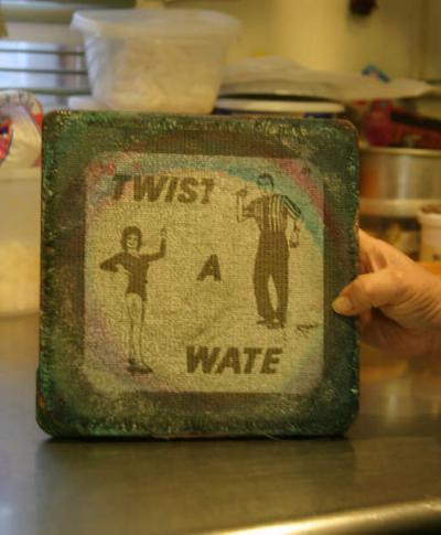 Lil's cake stand is a vintage "Twist-a-Wate" a device to help you learn how to dance. "It's got better ball bearings than any other cake stand I've ever used." BY CYRUS MOULTON