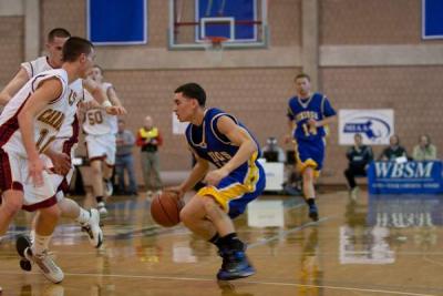 Wareham senior guard Mike Mendes trys to penetrate the Cardinal Spellman defense in the first half of Saturday's game. BY ANDREW W. GRIFFITH
