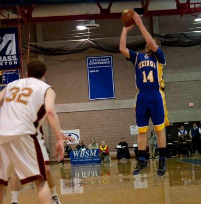 Pat Murphy pulls up for a short jumper over Cardinal Spellman defender Jesse Anderson. BY ANDREW W. GRIFFITH