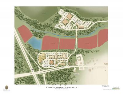 The site includes space for mixed-use commercial development including a restaurant, hotel, and a bank branch along the junction of Route 28 and Interstate 195 at the front of the property. The new medical building will be across the cranberry bogs, the farthest building on the left. There is currently a large American flag marking the spot. COURTESY A.D. MAKEPEACE COMPANY, SOUTHCOAST HEALTH SYSTEM, AND SUFFOLK CONSTRUCTION COMPANY, INC.