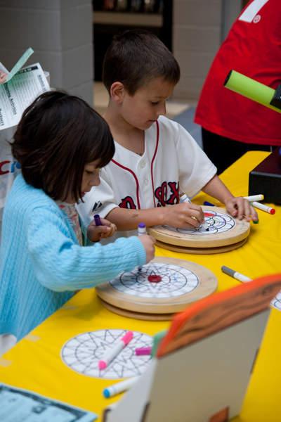 Siblings Alex and Madeline Wright colored in designs for the Cape Cod Children's Museum kaleidoscope exhibit. BY ANDREW W. GRIFFITH