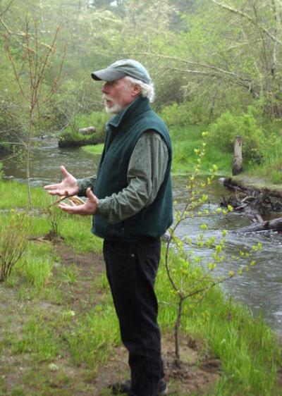 Warren Winders, Red Brook director for the Massachusetts and Rhode Island Council of Trout Unlimited, describes the efforts to restore the riverbank on which he stands. BY CYRUS MOULTON