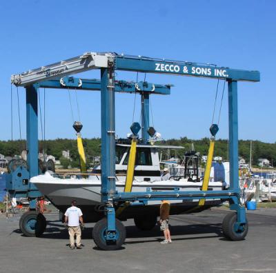 The new boat is moved inside a Zecco Marina building, where it will be lettered and equipped with police and fire radios before launching in Onset. BY JAIME REBHAN