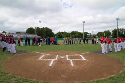 The Gatemen and Cotuit Kettleers line up on the base paths along with visiting guests at the Cape Cod League Opening Day ceremonies on Sunday, June 13. BY ANDREW W. GRIFFITH