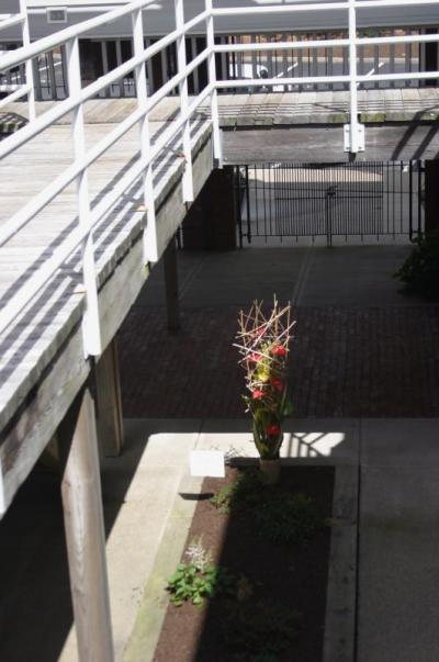 The atrium at British Landing Condominiums provided an architectural backdrop appropriate for the sculptural floral displays made by Garden Club members, such as this one made by Robin Murphy. BY CYRUS MOULTON