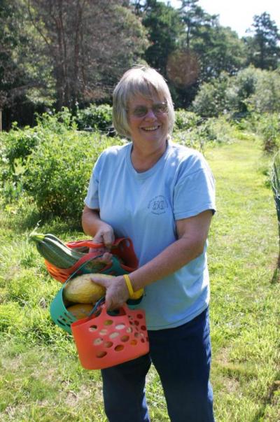 Sandy Slavin holds the 'vegetables' of her labor. But she and her husband Alan don't eat too much produce, so they donate them to the Council on Aging or a homeless shelter to be used in baking. BY CYRUS MOULTON