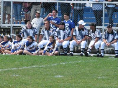 The refees and umpires joined the Fairhaven cheerleaders to enjoy the the halftime program at Fairhaven High School on Saturday. BY PATRICK LESTER
