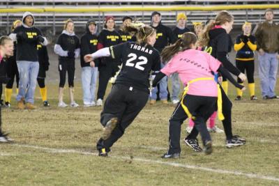 Felicia Thomas runs the ball down the field, gaining some yards for The Black Ops. Thomas says that she enjoys football, and wouldn't mind seeing a girls football team at Wareham High School. BY BARBARA THOMAS