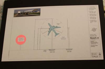 A diagram presented by Christopher Senie, a lawyer hired to represent a group of Blackmore Pond Road residents, shows the height of the proposed Bog Wind turbines as compared to that of the turbine at Massachusetts Maritime Academy (pink dot). It also shows how big the "swept area," the circle formed by the blades of the turbine, would be (slightly larger than a Boeing 747 airplane). BY JAIME REBHAN