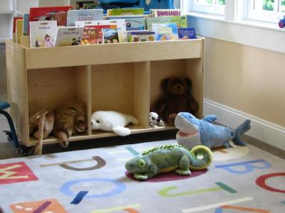 A children's area is furnished with donated books, toys, games and stuffed animals. BY PATRICK LESTER