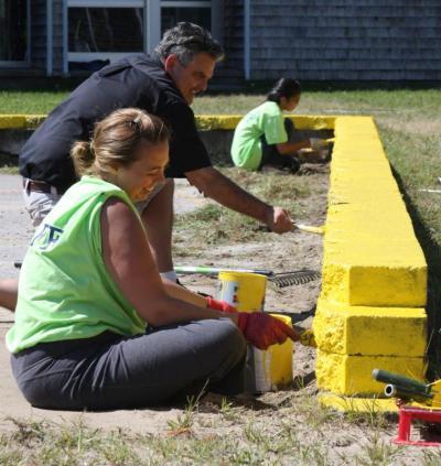 Parent volunteer Kelly Savory Powers and her husband, Doug Powers, painted the wall surrounding the school's four square courts. The couple has a daughter in second grade named Olivia. BY JAIME REBHAN