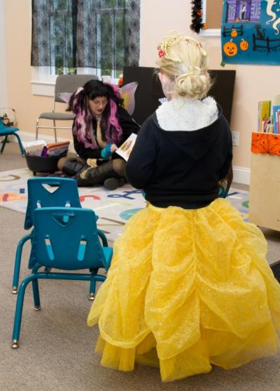 A princess listens to story time at Spinney Memorial Library during Family Fun Day Saturday, Oct. 29. BY ANDREW W. GRIFFITH