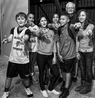 The late Dr. Charles "Sherm" Gleason posed for a photo with Gleason Family YMCA teens in anticipation of the final push to finish the capital campaign. Pictured (l to r) Nick Galavotti, Anthony Olivera , Alysha Andrade, Victoria Getchell, Isaiah Gomes, the late Dr. Charles Gleason and Mariah Whitney who offered to help get the message to finish the expansion. BY KEVIN FORTI