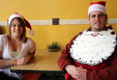 Mrs. Claus (Jen Murdock) and Santa Claus (Brandon Field) assisted with ornaments at the Fresh Food Cafe. BY JAIME REBHAN