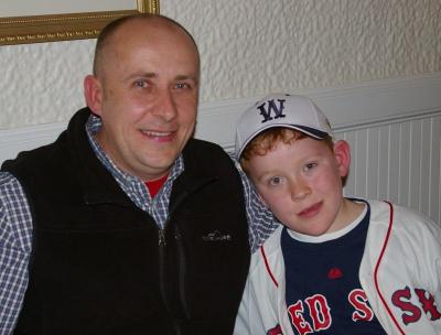 Ken Spenard poses with his son while Garciaparra answers questions from the audience. BY RISHI SIDHU