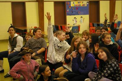 Decas Elementary School 5th graders raise their hands to offer suggestions about what to do in response to the Tea Tax imposed by the British. BY RISHI SIDHU