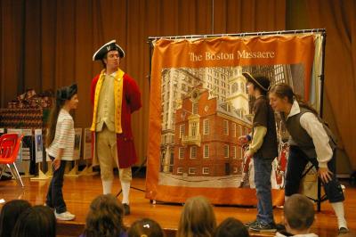 Tensions rise as 5th graders Seraphina McGrath (left), a "Redcoat" and John McDougal (right), a "Bostonian" throw the first insults of the Boston Massacre. BY RISHI SIDHU
