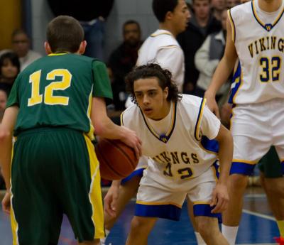 Vikings sophomore Mason Vasconcellos plays defense against Falcons junior Ryan Walsh. BY ANDREW GRIFFITH