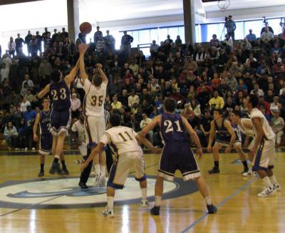 Jeff Houde jumps against Martha's Vineyard forward Peter Keaney to open Saturday's Division 3 South Section championship game at UMass Boston BY PAT