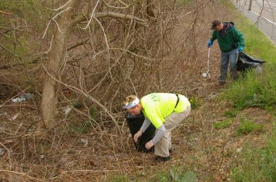 Wareham Area Litter Mob volunteers Mary Bruce and Mike Russell take on a heavily littered area next to Old Onset Road. Woody areas often have a lot of litter, Russell said. BY RISHI SIDHU