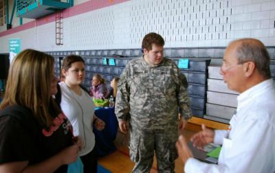 Larry Kenney, radiologic technician at St. Anne's Hospital, talks to students about a careers in the health care field. BY RISHI SIDHU